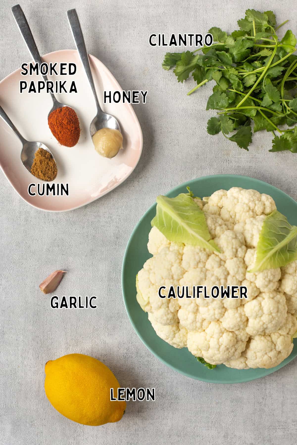 Ingredients for air fryer cauliflower steaks laid out with text overlay.