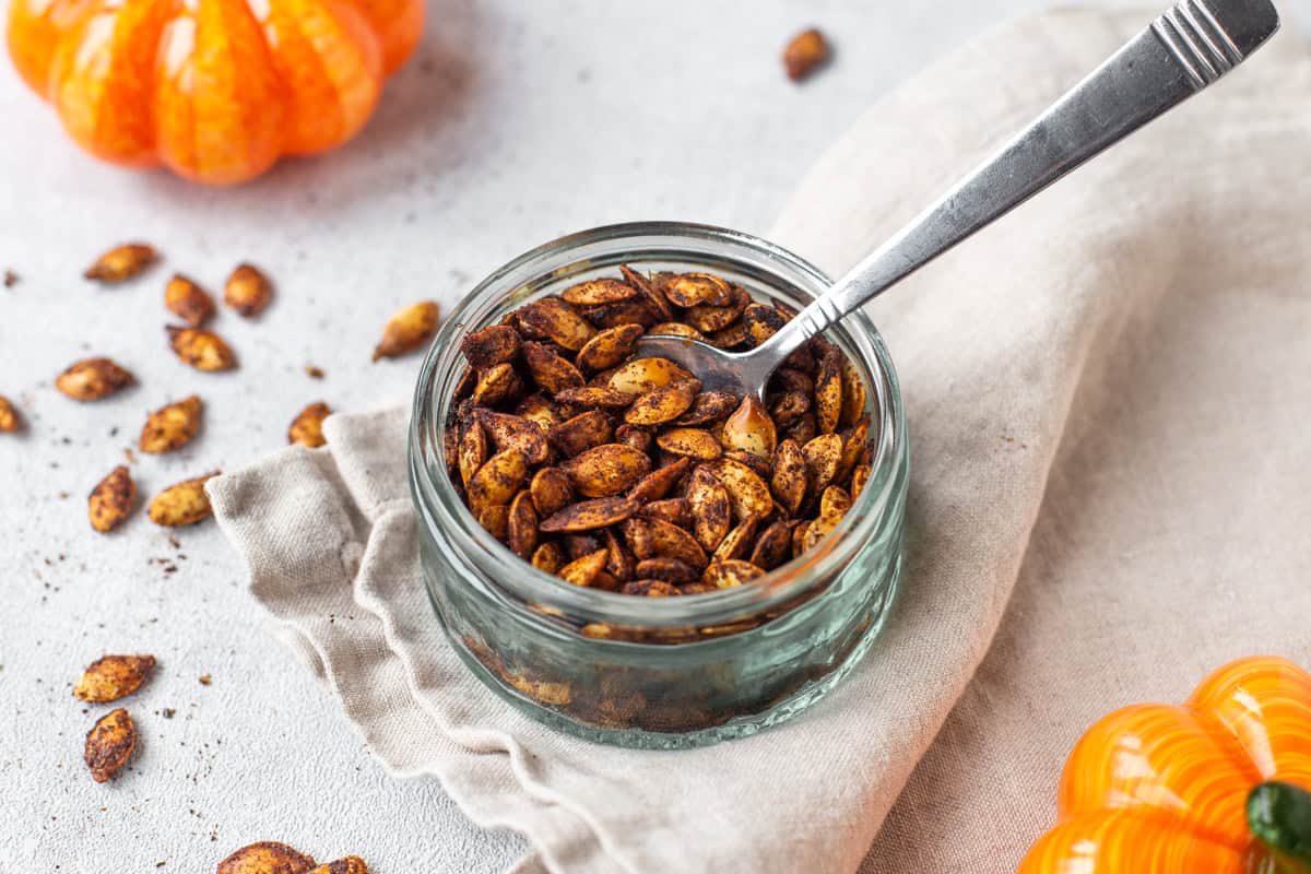 A small bowl of air fried pumpkin seeds.