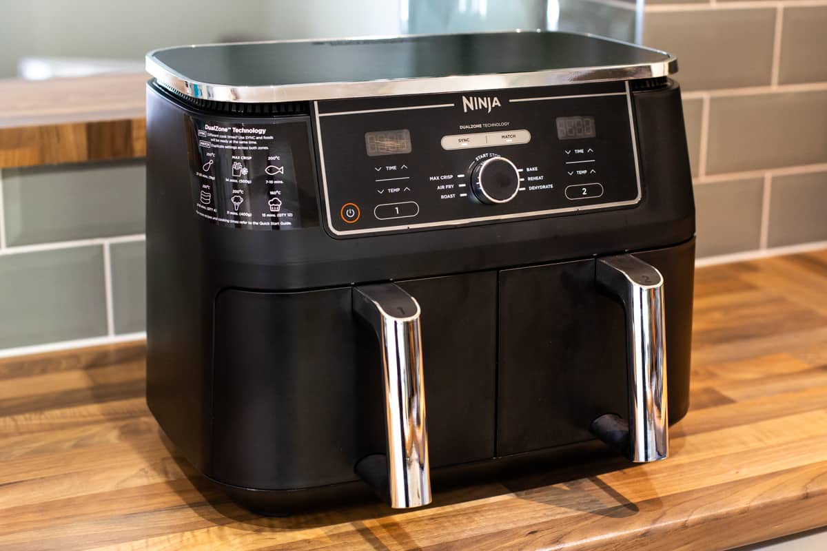 Ninja Foodie MAX Dual Zone air fryer on a kitchen worktop.