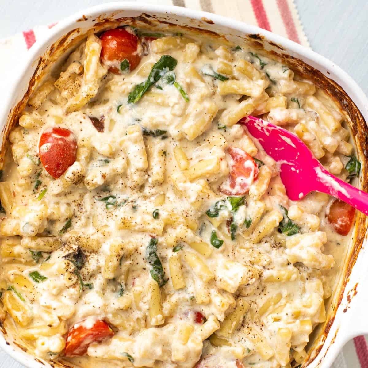 Cheesy baked feta mac and cheese in a baking dish.