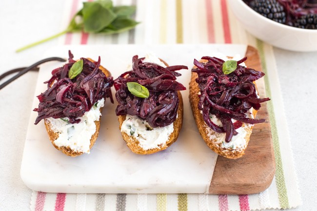 Basil and goat’s cheese crostini with balsamic blackberry compote
