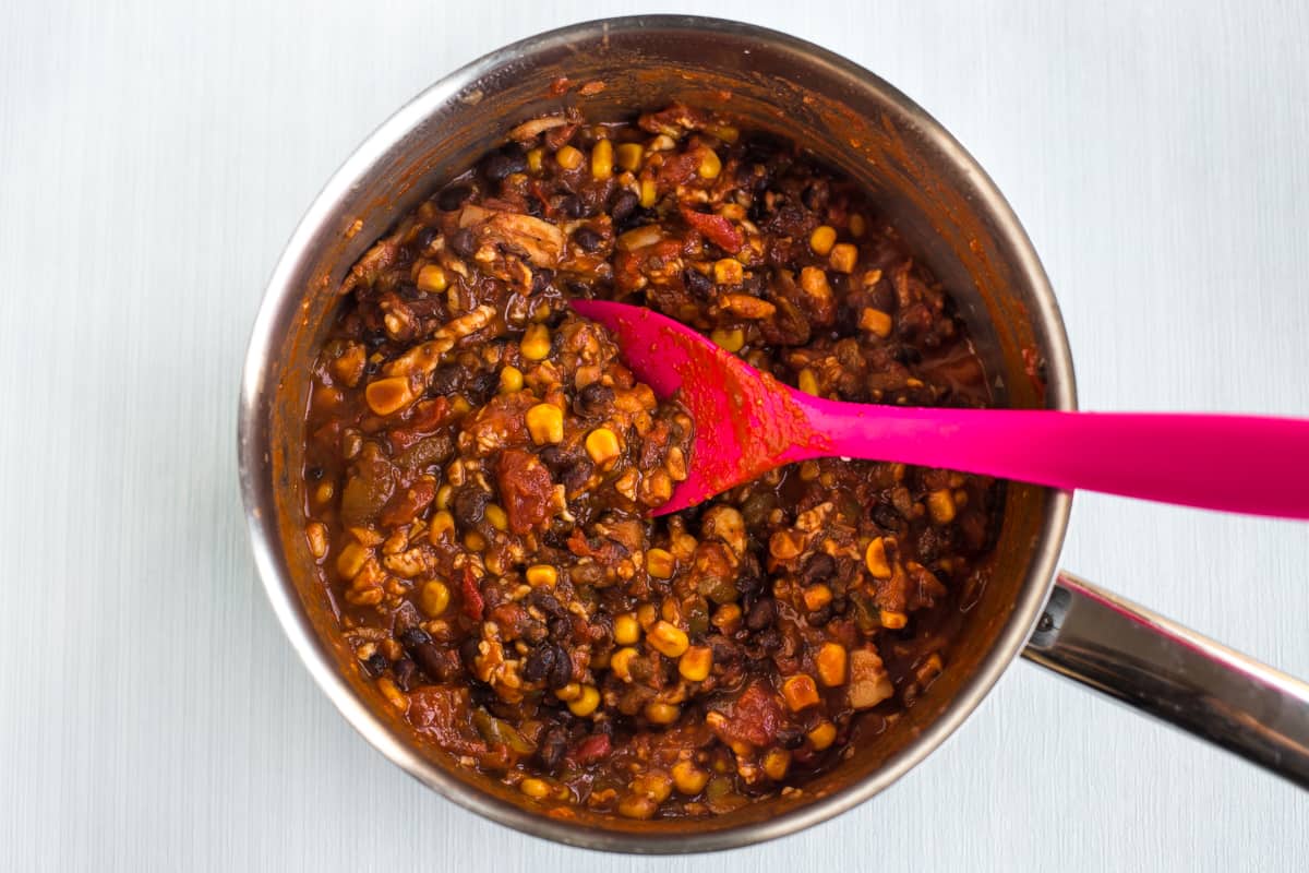 Vegetarian black bean chilli in a saucepan.