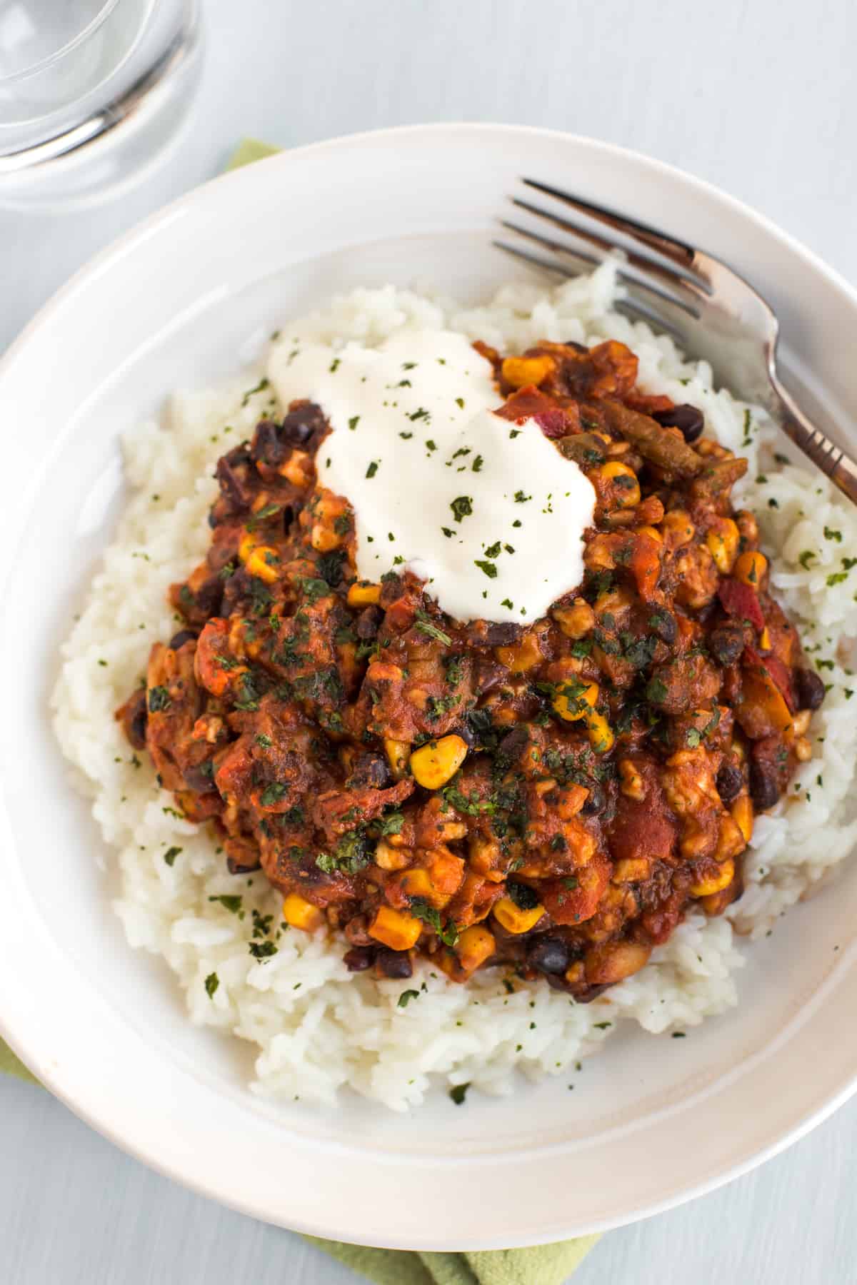 Overhead shot of vegetarian chilli and rice in a bowl.