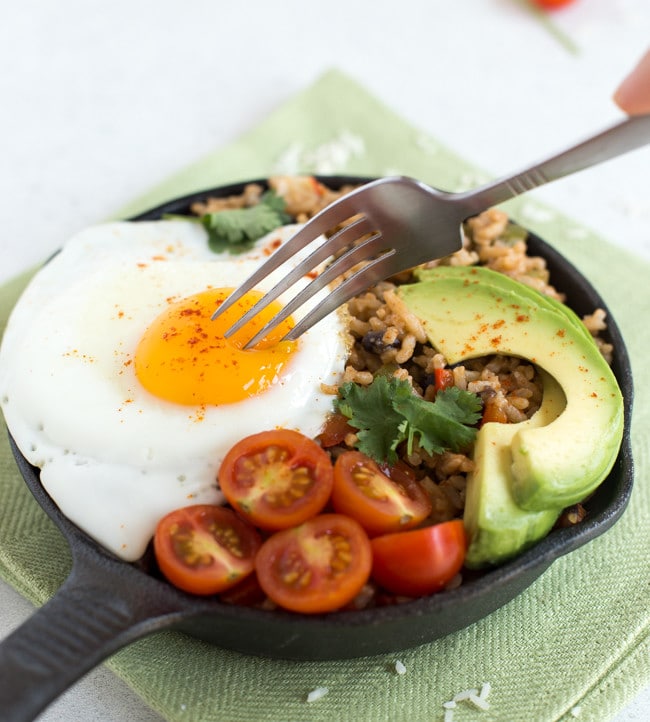 Breakfast rice and beans - my own take on a Costa Rican dish called pinto gallo! This delicious vegetarian recipe contains a complete protein, healthy fats and tons of veggies! The perfect way to start the day.