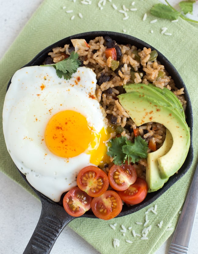 Breakfast rice and beans - my own take on a Costa Rican dish called pinto gallo! This delicious vegetarian recipe contains a complete protein, healthy fats and tons of veggies! The perfect way to start the day.