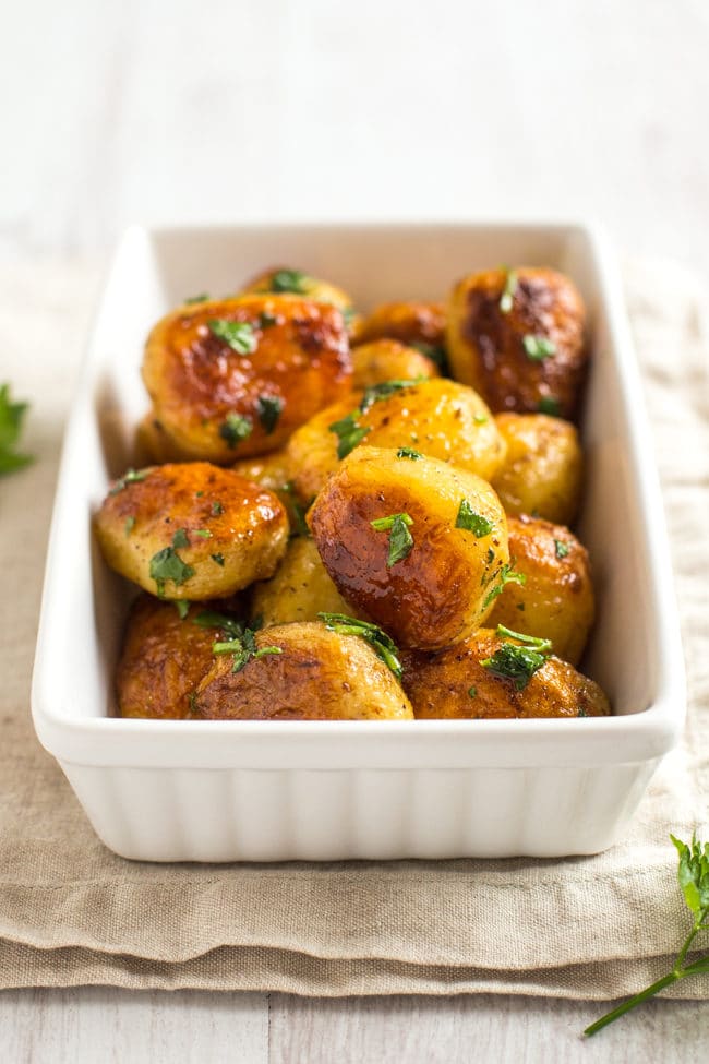Buttery chateau potatoes - cooked in garlicky butter, then roasted until they're nice and crispy. SO GOOD! The perfect potato side dish.