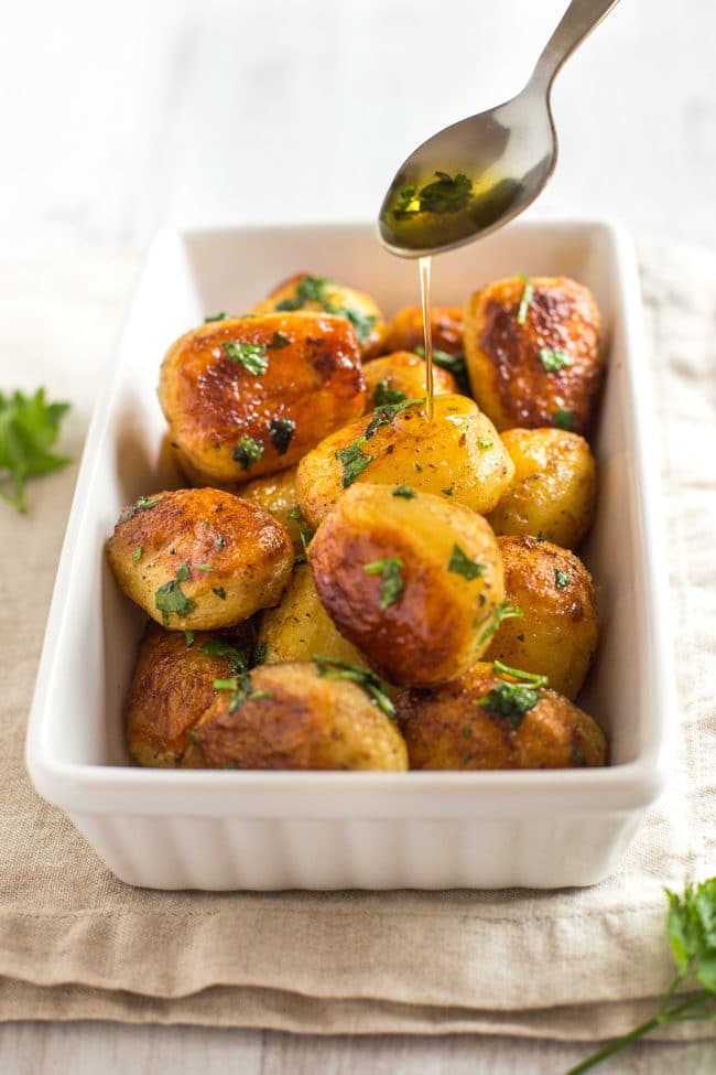 Buttery chateau potatoes - cooked in garlicky butter, then roasted until they're nice and crispy. SO GOOD! The perfect potato side dish.