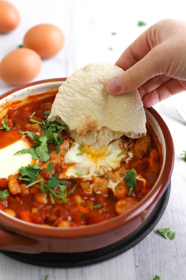 Cannellini bean shakshuka (eggs baked in a rich tomato sauce) - a hearty, high protein breakfast or lunch. It's vegetarian, really easy to make an totally delicious!