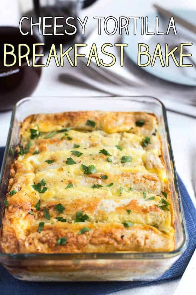 A pan of cheesy tortilla breakfast bake topped with fresh herbs.