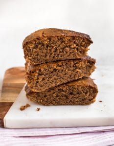 Chocolate brownies stacked on a board