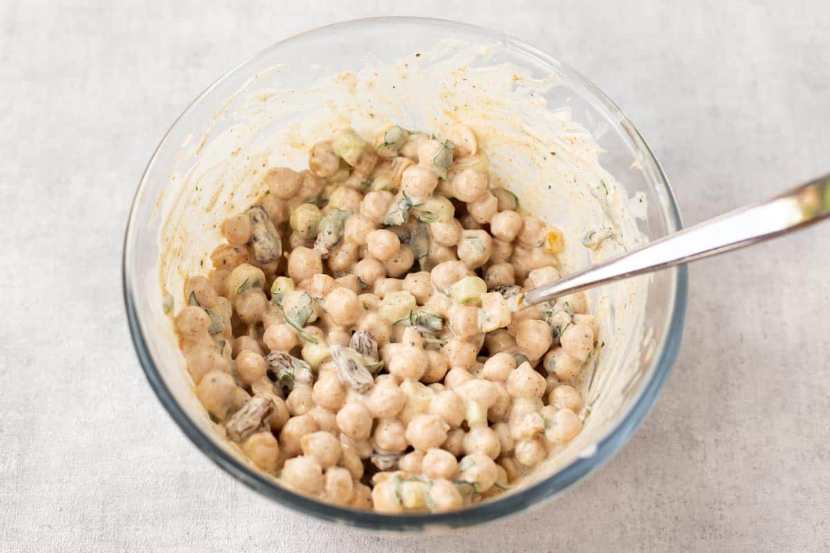 Coronation chickpeas in a mixing bowl.