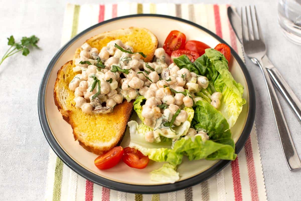 Curried coronation chickpeas on toast and lettuce.