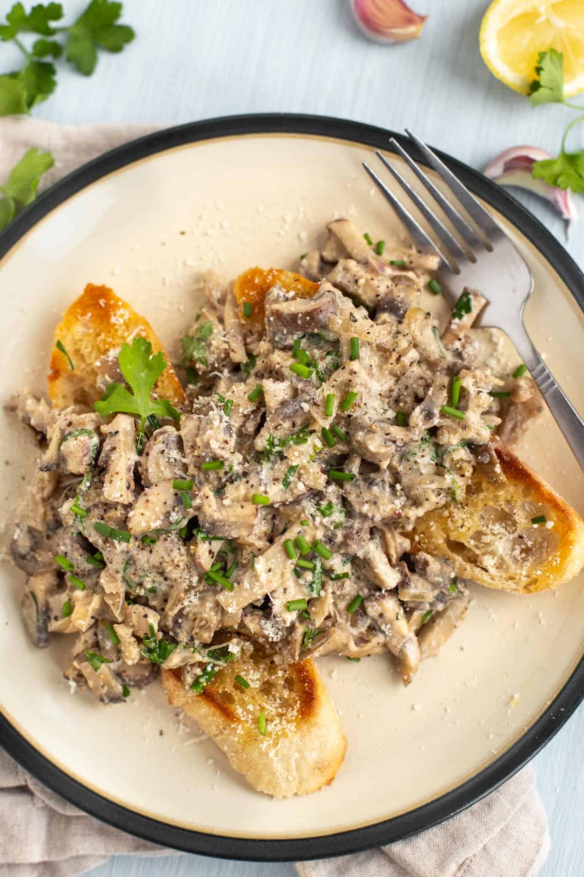 Mushrooms in a creamy sauce served on toasted baguette.