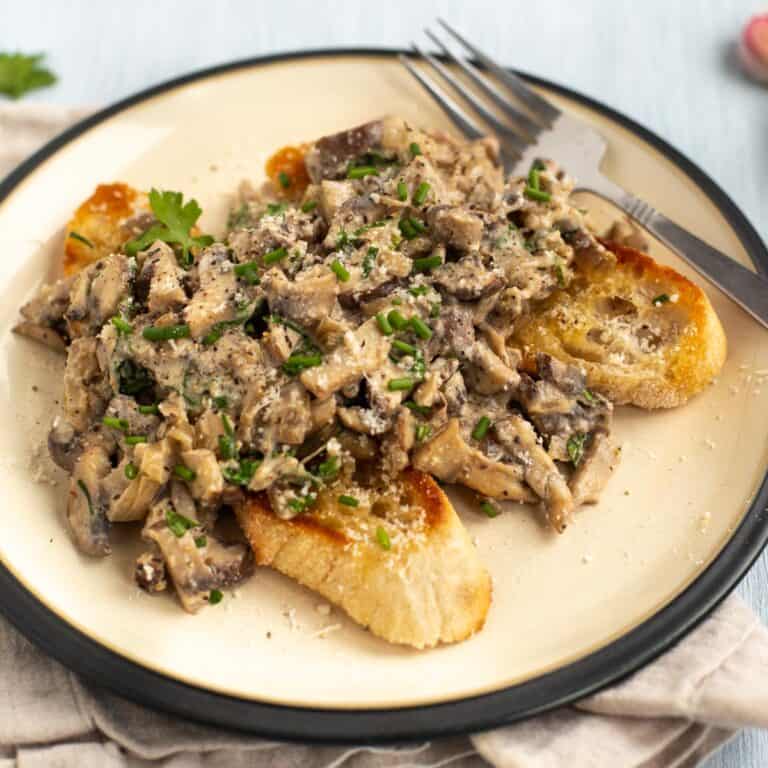 Creamy mushrooms on toast, topped with fresh chives.