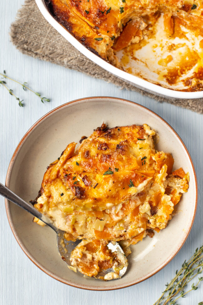A portion of creamy sweet potato bake in a bowl.