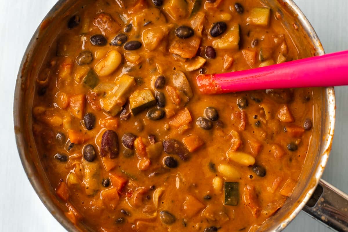 Creamy three bean stew in a saucepan.