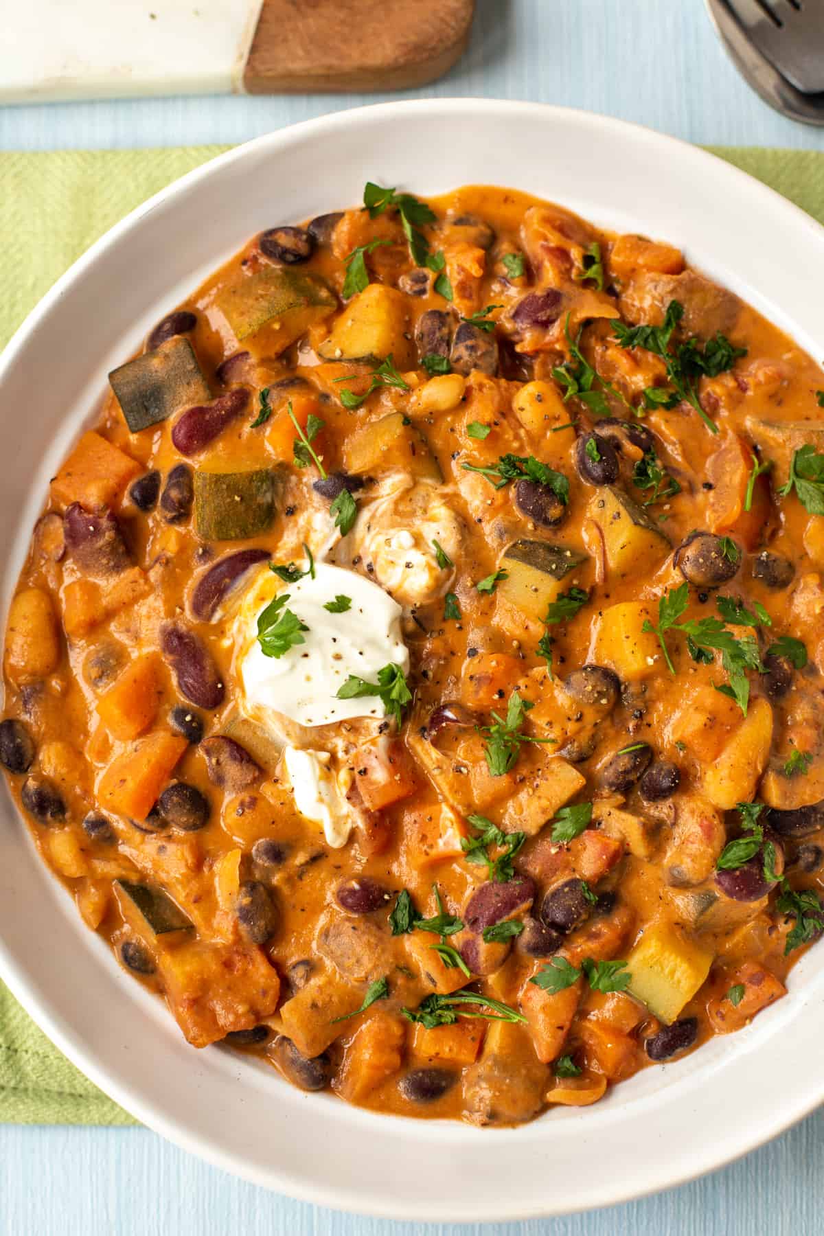 Overhead shot of a bowl of creamy three bean stew.