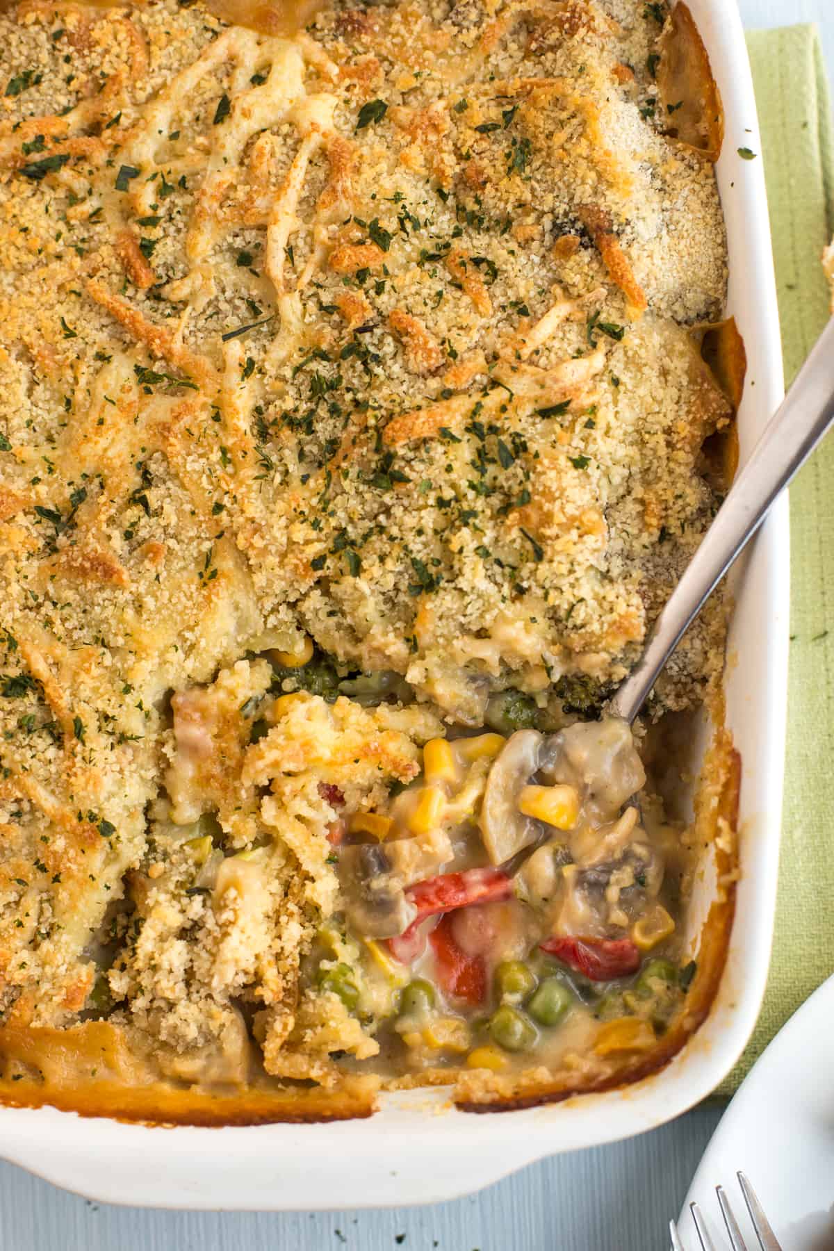 Shot from above, vegetables in a creamy sauce with a crispy breadcrumb topping.
