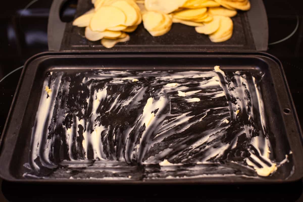 A thoroughly buttered metal baking sheet.