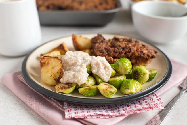 A vegetarian roast dinner with homemade bread sauce.