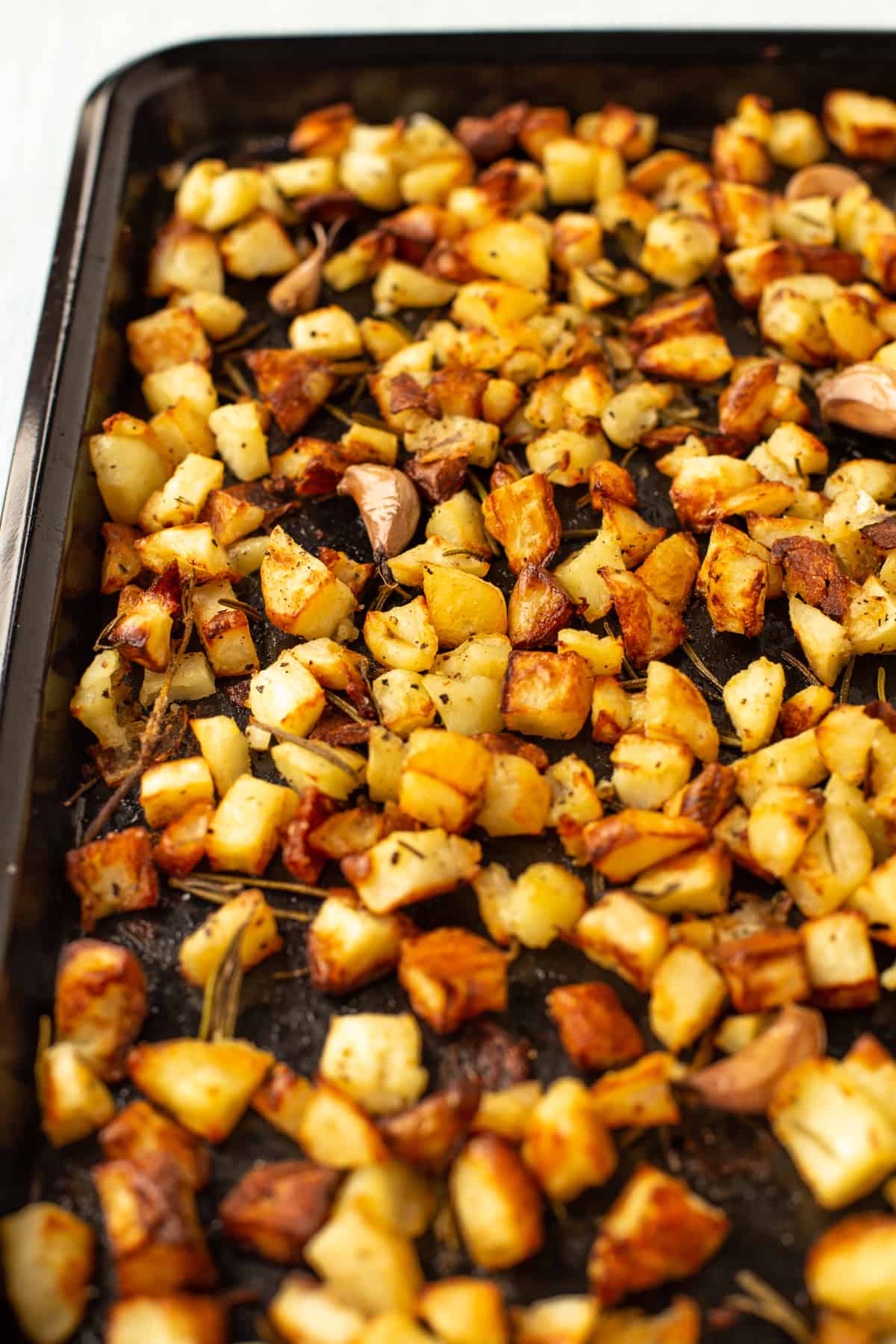Crispy Parmentier potatoes on a baking sheet.