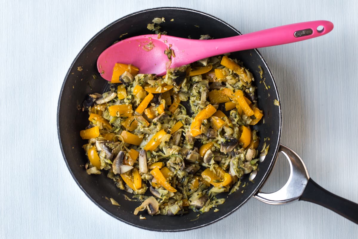 Vegetables cooking in a frying pan.