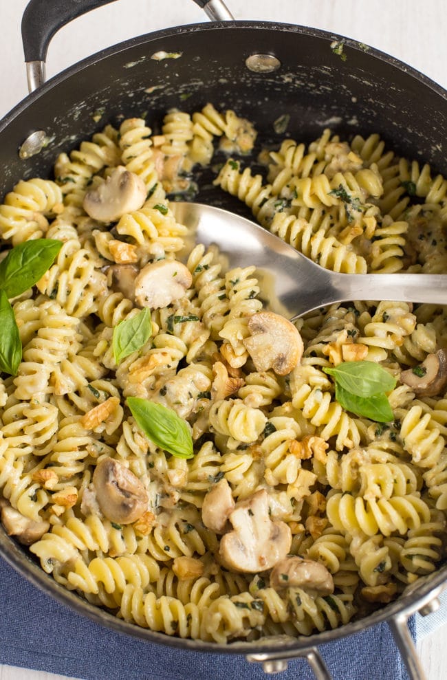 Creamy goat's cheese and mushroom pasta with walnuts and basil. The walnuts add such a beautiful crunch - it's great against the creamy sauce! A brilliant quick and easy vegetarian dinner.