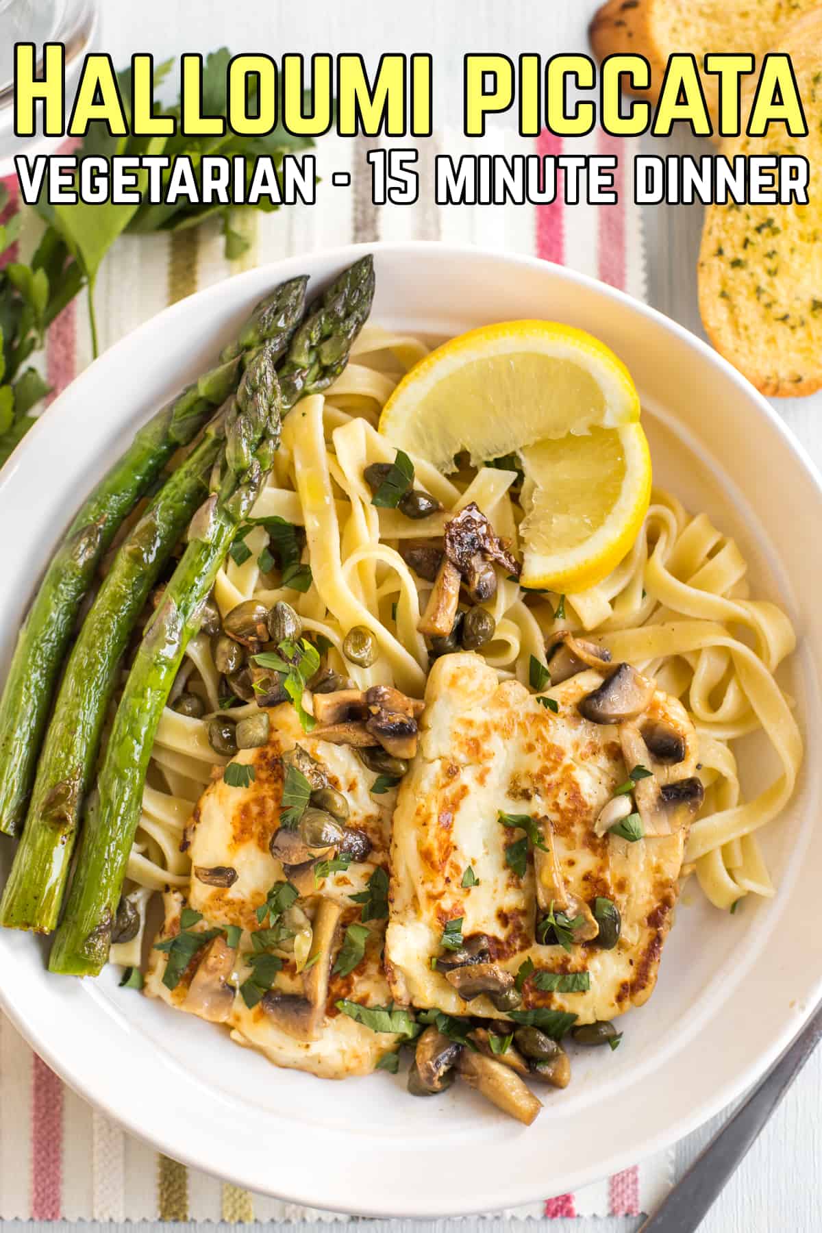 Portion of halloumi piccata served with tagliatelle and asparagus