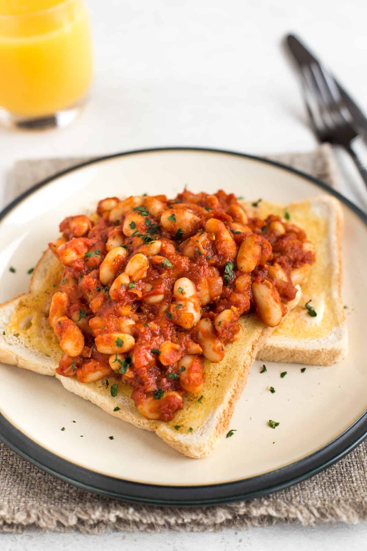 Two slices of toast with homemade baked beans.