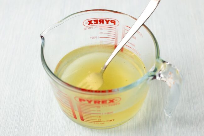 Vegetable stock in a Pyrex jug.