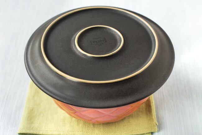 A bowl covered with a plate.