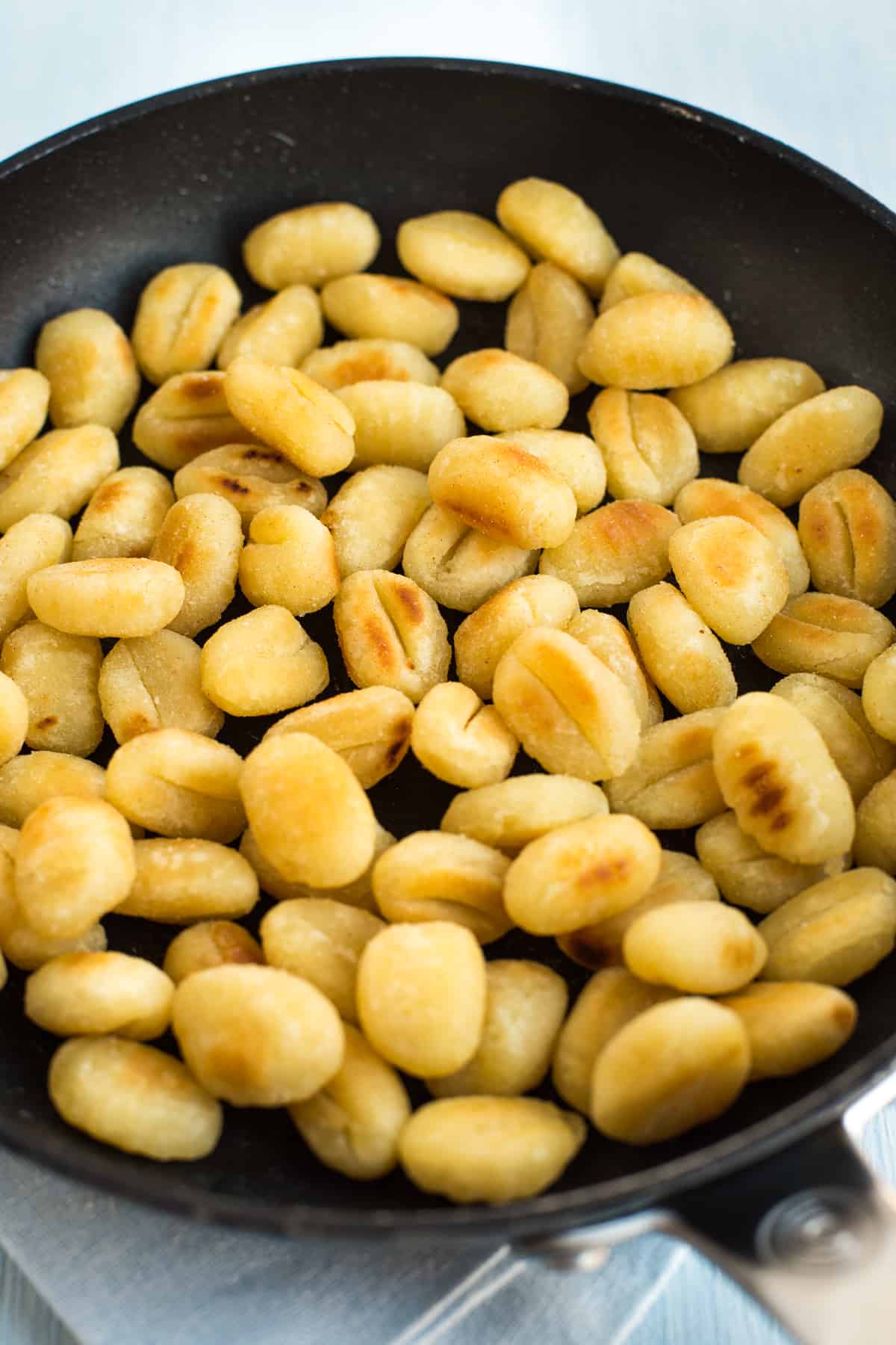 Fried gnocchi in a pan.