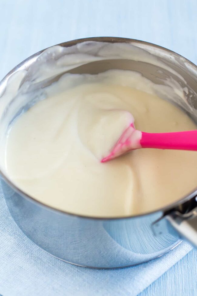 A creamy white sauce in a saucepan