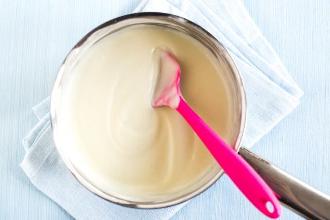 A completed creamy white sauce in a saucepan