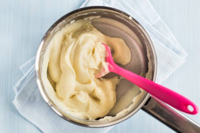 A very thick white sauce in a saucepan
