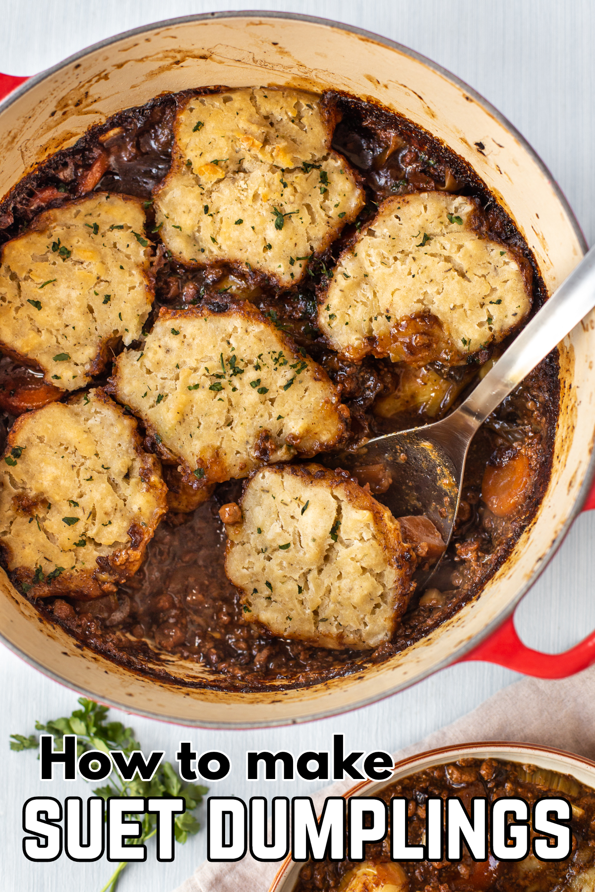A pot of gravy-based stew topped with suet dumplings.