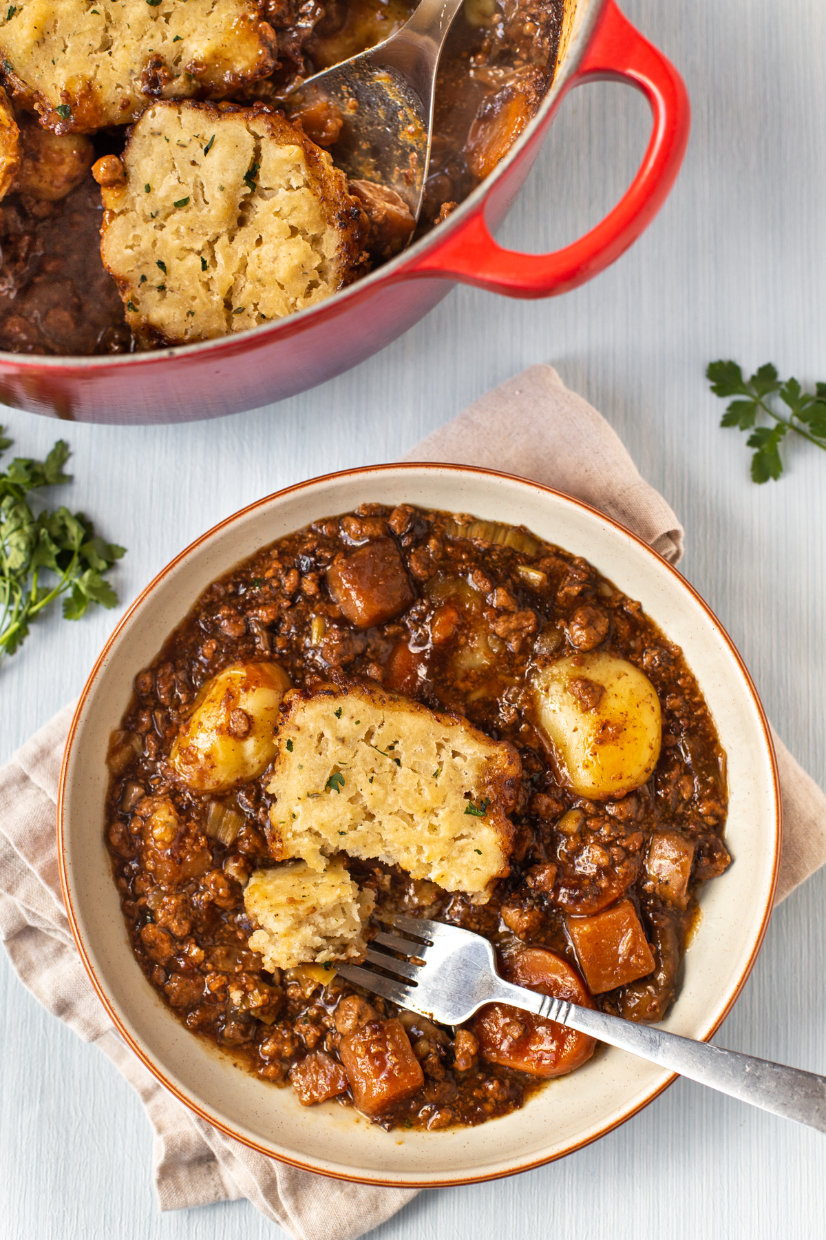 A bowl of vegetarian beef stew topped with a suet dumpling.