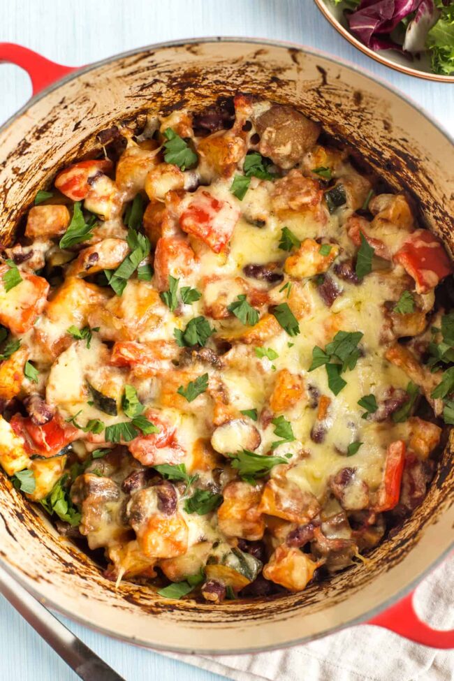 A cheesy potato casserole in a large pan.