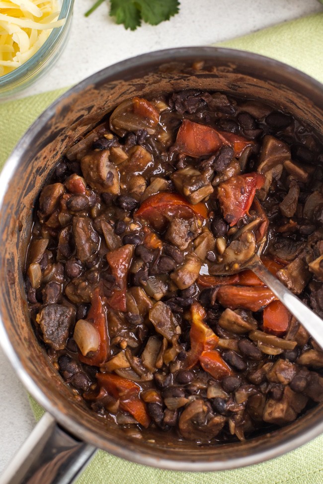 Mushroom and black bean chilli in a saucepan shot from above
