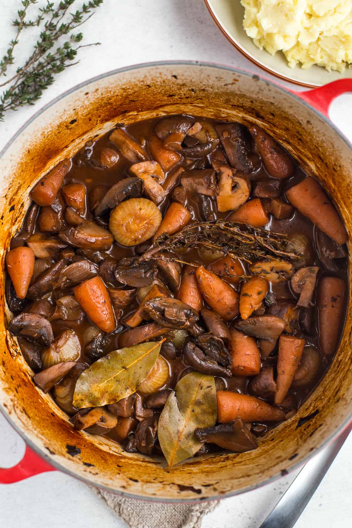 Large casserole dish filled with mushroom bourguignon.