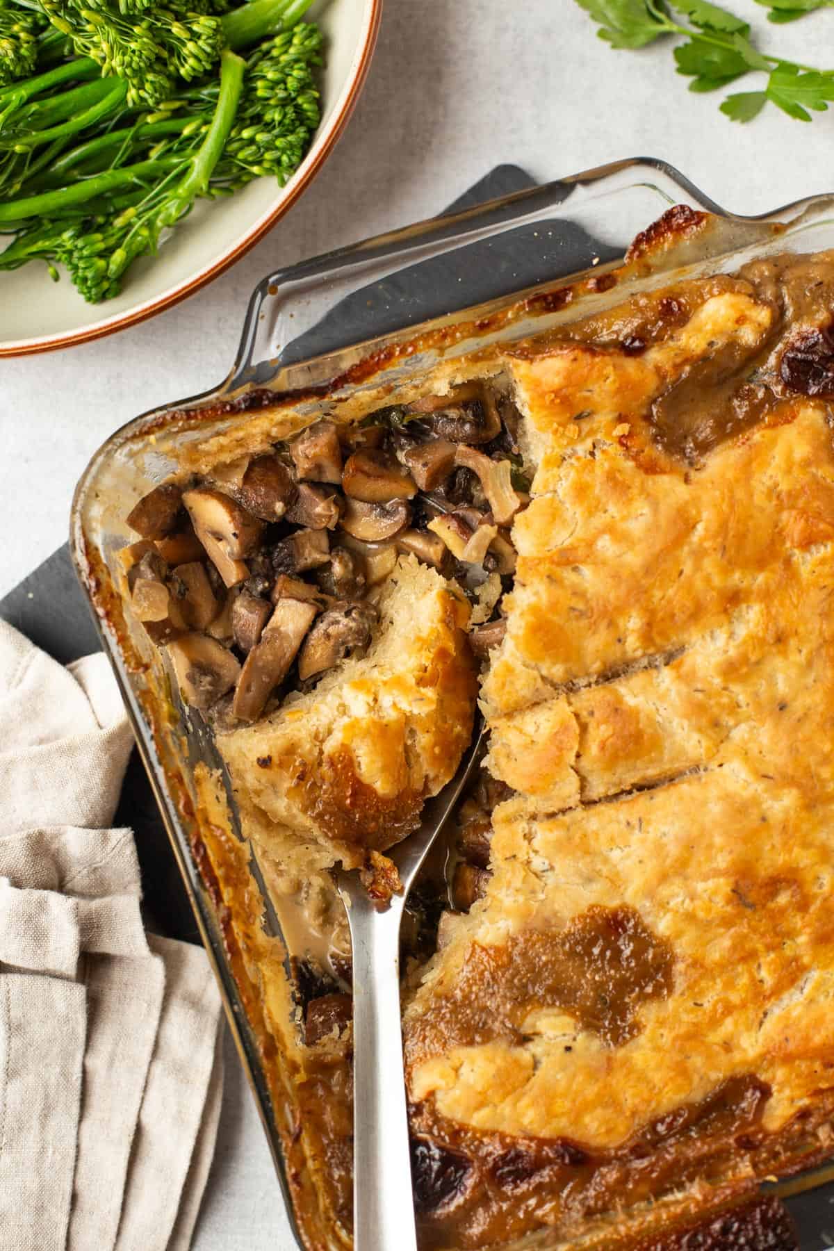 Overhead shot of a crispy mushroom pie with a suet crust.
