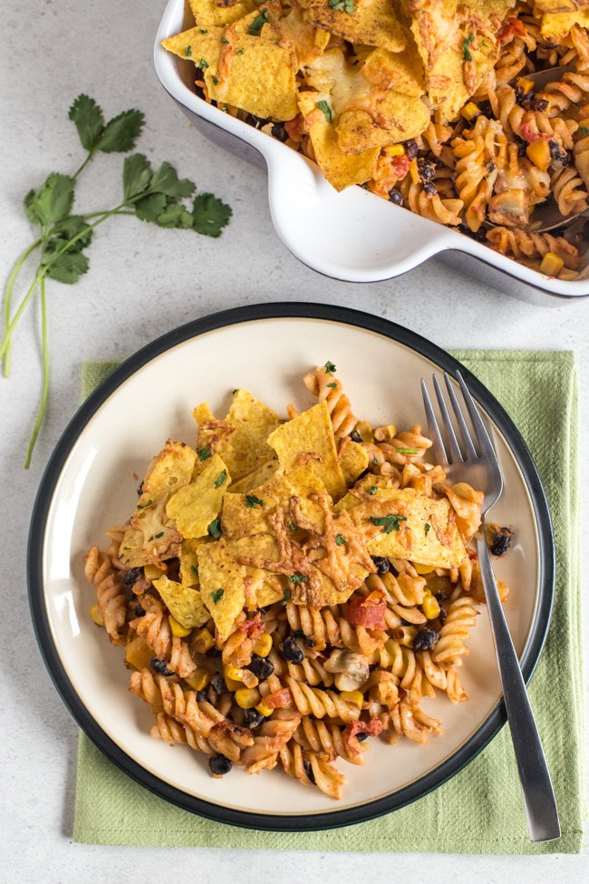 Nacho pasta bake - a creamy, spicy, vegetarian Mexican inspired pasta bake topped with tortilla chips and plenty of cheese!