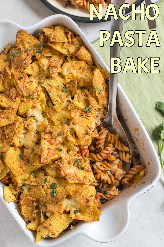 Nacho pasta bake - a creamy, spicy, vegetarian Mexican inspired pasta bake topped with tortilla chips and plenty of cheese!