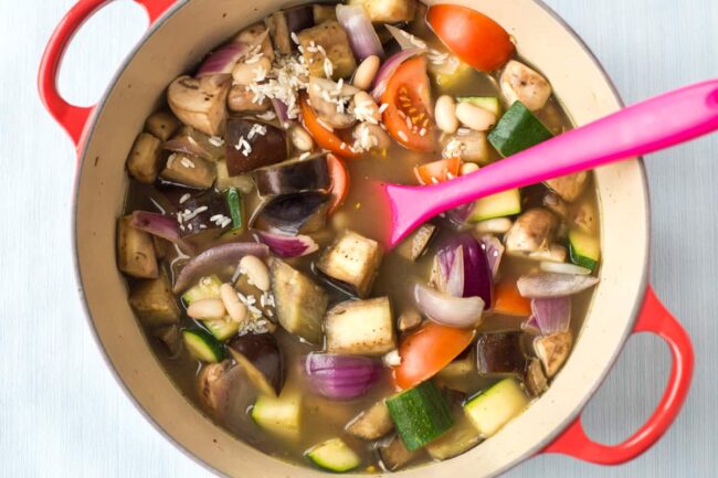 Uncooked vegetable casserole with rice and beans.