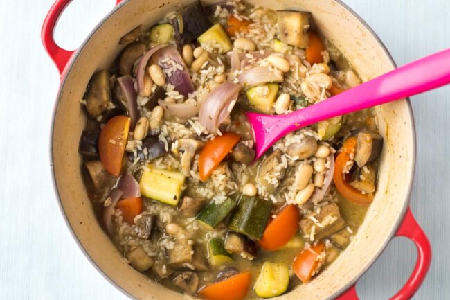 Rice and vegetable casserole in a large casserole dish.