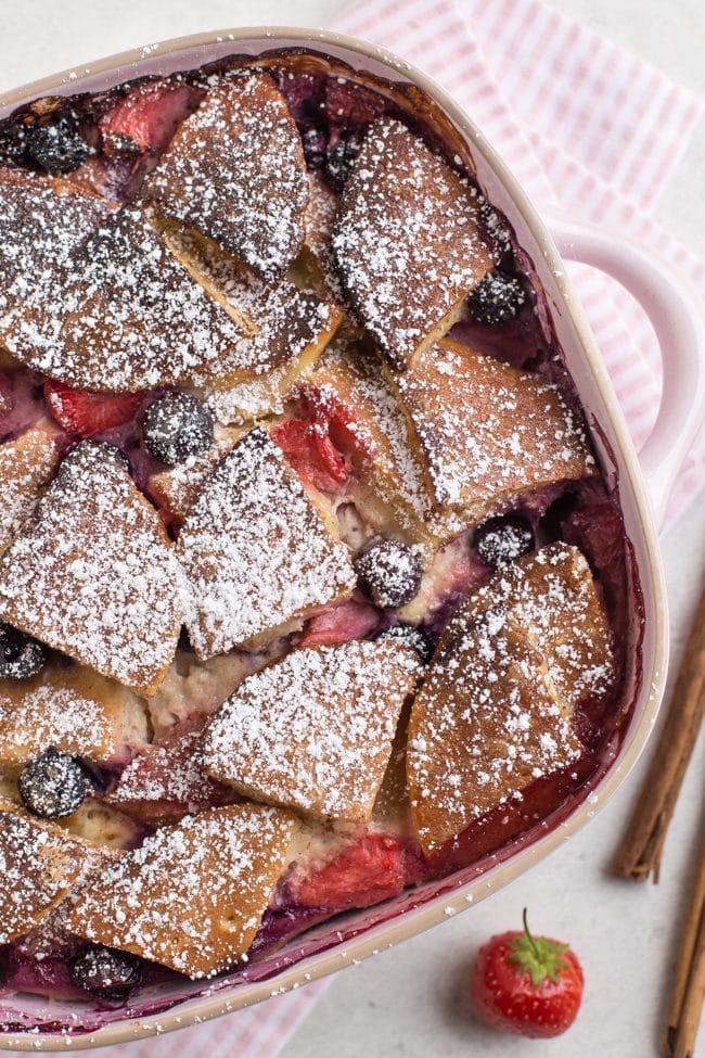 Baked pancake pudding with fresh fruit in a baking dish