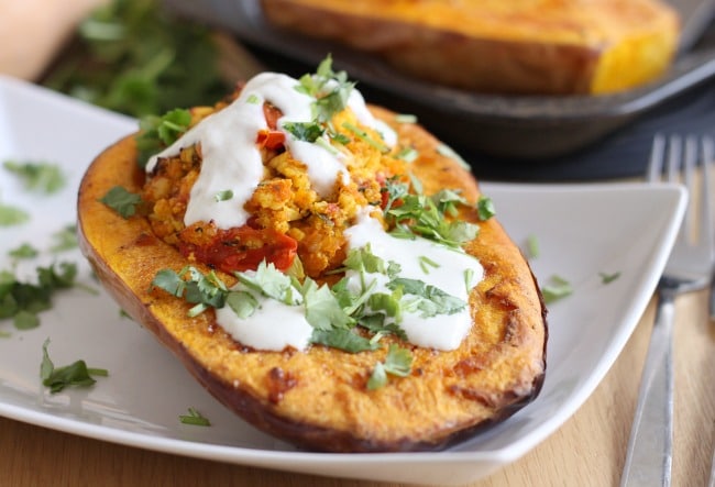 Paneer stuffed butternut squash with spiced yogurt