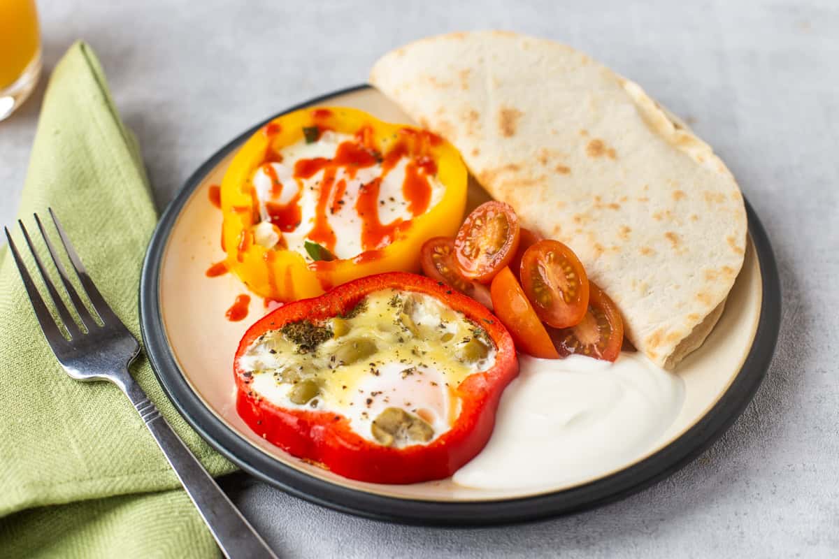Fried eggs cooked inside rings of bell pepper.