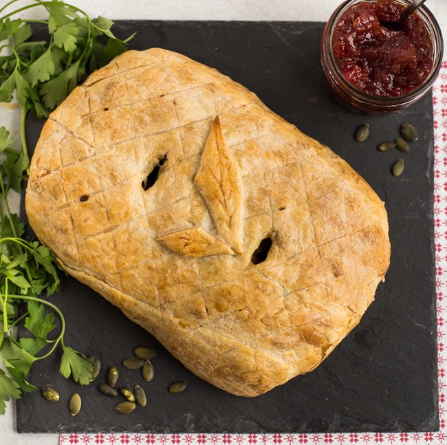 Crispy vegetarian roasted veggie en croute on a slate board