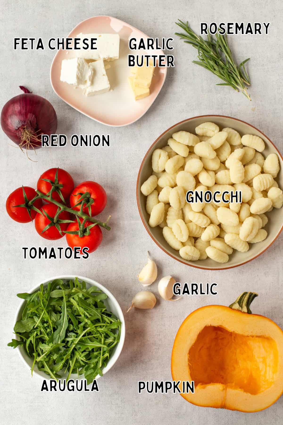 Ingredients for sheet pan gnocchi with pumpkin laid out with text overlay.